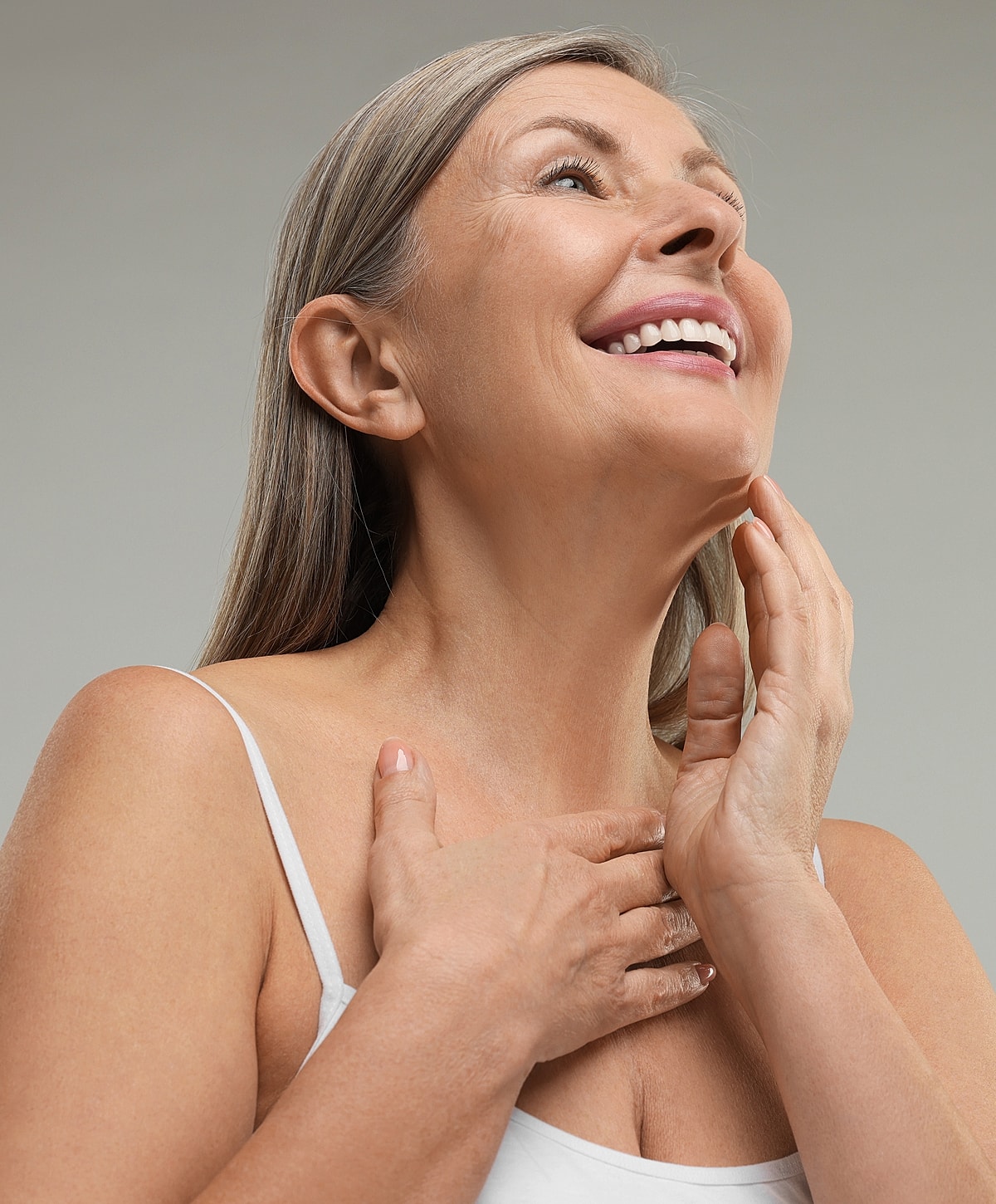 Smiling older woman with graceful expression.